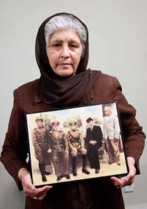 Tajwar holding a picture of her father (far left)